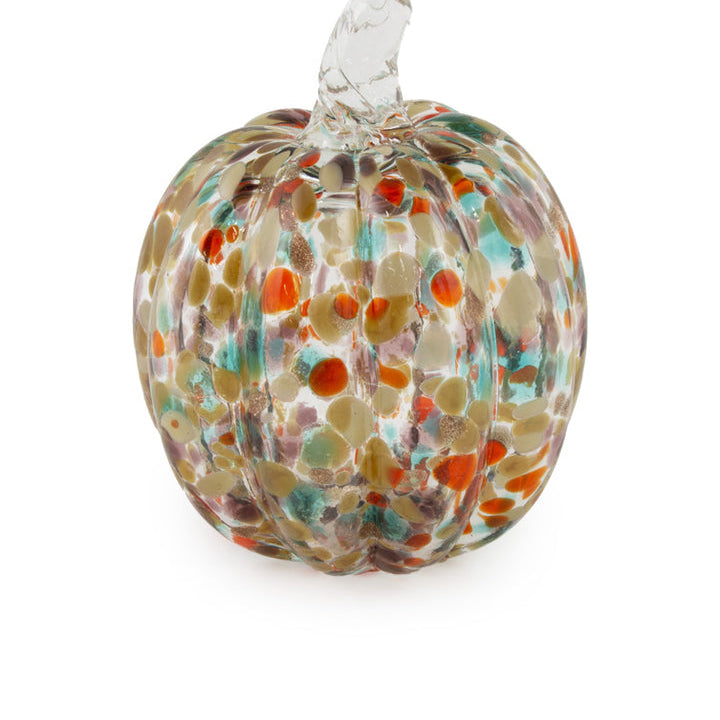 Glass pumpkin with multicolored speckles on a white background. Available at Be Charmed