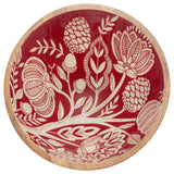 Decorative plate with white floral patterns on a red background. Available at Be Charmed