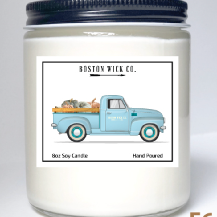 Boston Wick Company Truck with Pumpkins soy candle in glass jar featuring vintage truck loaded with pumpkins, hand‑poured in MA, available at Be Charmed.