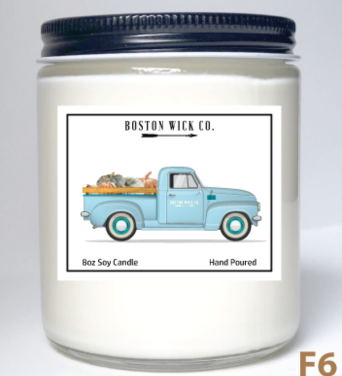 Boston Wick Company Truck with Pumpkins soy candle in glass jar featuring vintage truck loaded with pumpkins, hand‑poured in MA, available at Be Charmed.