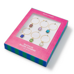 Set of bejeweled glass charms in a pink and blue box packaging. Available at Be Charmed
