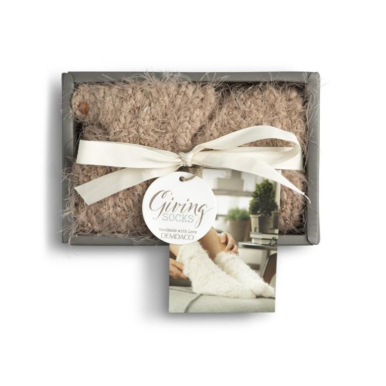 Box of socks with a bow and 'Giving Socks' label on a white background.  Available at Be Charmed