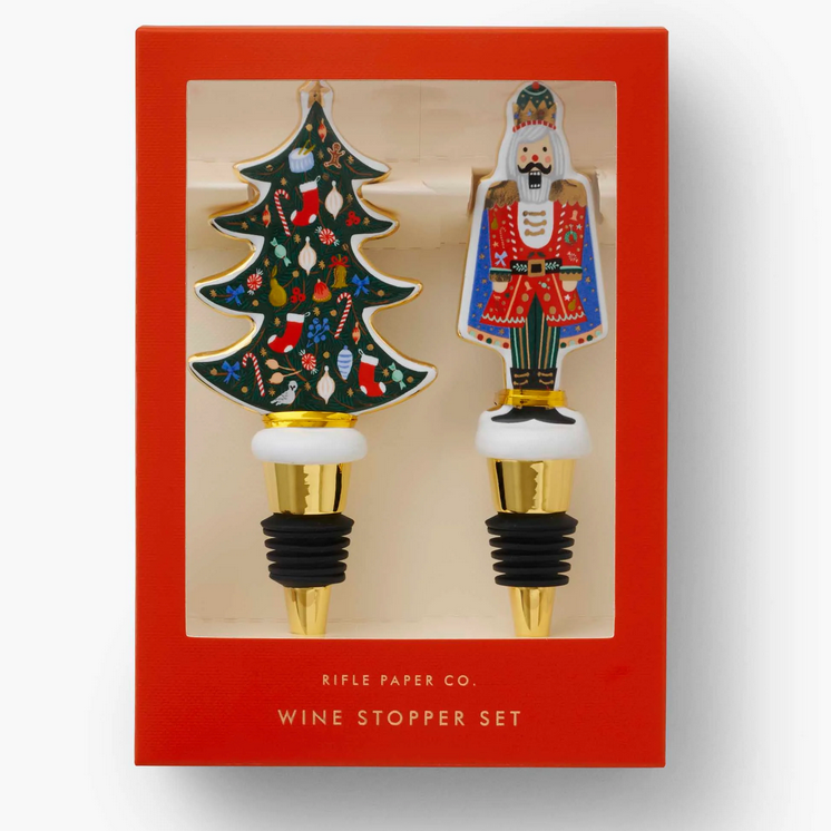 Boxed Nutcracker and Christmas tree porcelain wine stoppers with gold accents—Available at Be Charmed