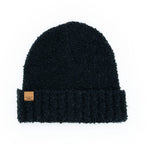 Black Common Good Recycled Hat – eco-friendly knit beanie made from recycled materials, soft, warm, and sustainably stylish, available at Be Charmed