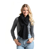 Black as a scarf Willow Convertible Shrug – ultra-soft knit piece worn as a shrug, wrap, or scarf, perfect for versatile styling and layering, available at Be Charmed