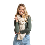 Oat as a scarf Willow Convertible Shrug – ultra-soft knit piece worn as a shrug, wrap, or scarf, perfect for versatile styling and layering, available at Be Charmed