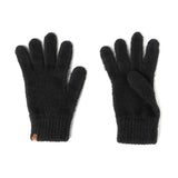 Pair of black gloves on a white background. Available at Be Charme