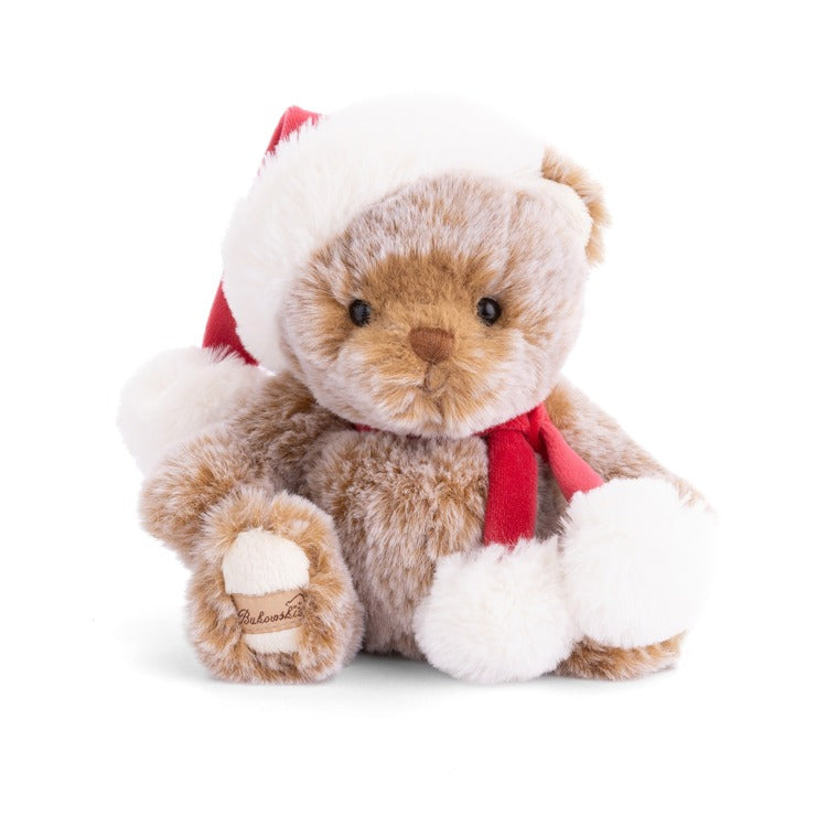 Bukowski Bear Plush teddy bear with a Santa hat and scarf on a white background. Available at Be Charmed