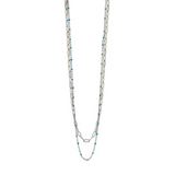 A delicate artisan-crafted Silver/Turquoise beaded layering chain necklace from the CAI jewelry collection, available at Be Charmed.