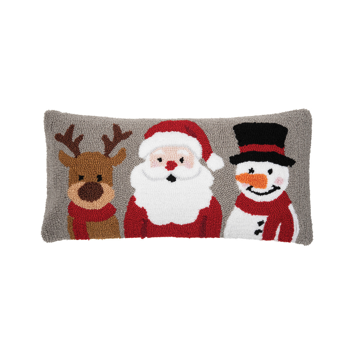A playful and cartoonish holiday accent pillow showcasing a textured snowman, Santa, and reindeer design, available at Be Charmed.