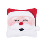 A festive winter accent pillow featuring a jolly, smiling Santa Claus face design in detailed texturized hooked yarn, available at Be Charmed.