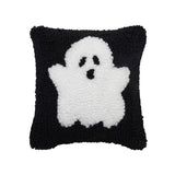 A festive mini Halloween accent pillow featuring a playful spooky ghost design in detailed texturized hooked yarn, available at Be Charmed.