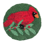 A festive mini round winter accent pillow featuring a vibrant red cardinal bird design in detailed hooked yarn, available at Be Charmed.