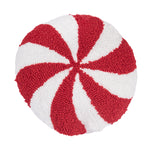 A festive mini round winter accent pillow designed in the shape of a classic holiday peppermint candy with textured hooked yarn, available at Be Charmed.