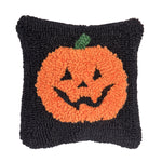 A festive autumn accent pillow featuring a plump orange harvest pumpkin design in detailed texturized hooked yarn, available at Be Charmed.