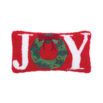 A festive red and white wool hooked accent cushion featuring the word Joy and a Christmas holiday wreath, available at Be Charmed.