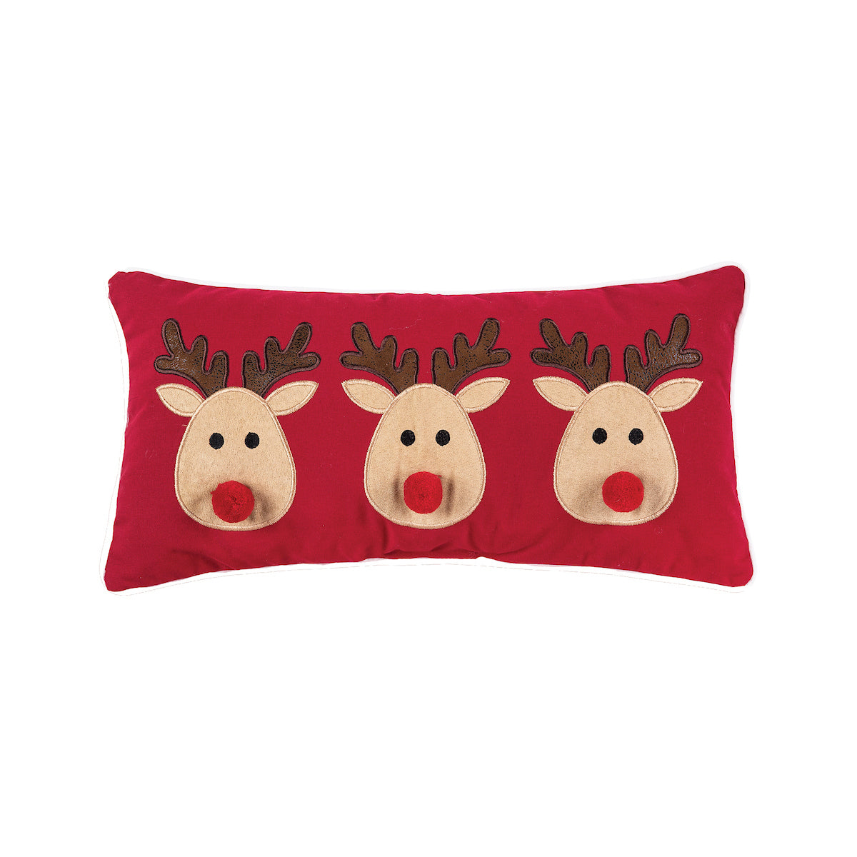 A festive red winter lumbar accent pillow featuring three cute holiday reindeers in applique detail, available at Be Charmed.