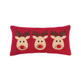 A festive red winter lumbar accent pillow featuring three cute holiday reindeers in applique detail, available at Be Charmed.