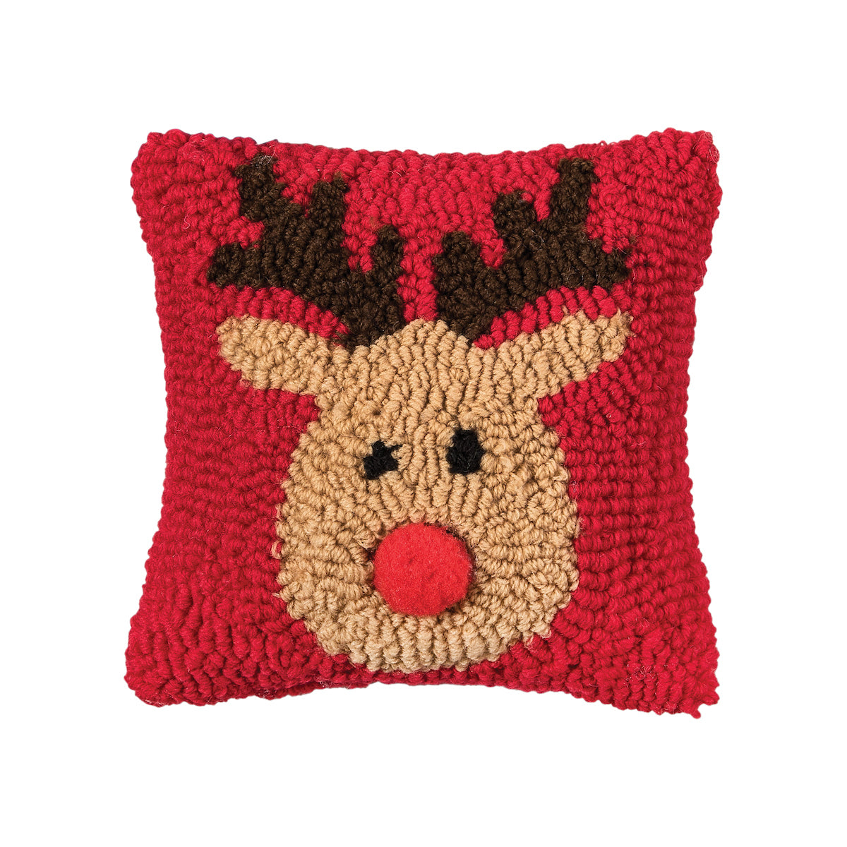 A festive red winter lumbar accent pillow featuring a cute holiday reindeer in hooked detail, available at Be Charmed.