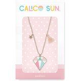 Carrie Gem Necklace by Calico Sun—a diamond-shaped pastel enamel gem pendant with tiny gold star and peach tassel on adjustable gold ball chain, available at Be Charmed.