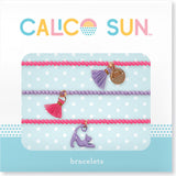 Zoey Cat Bracelet by Calico Sun—a fun adjustable cord bracelet with colorful enamel cat charm, perfect for kids and tween style, available at Be Charmed.