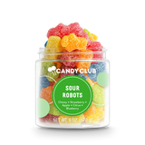 A clear plastic jar filled with various colorful gummy candies, labeled 'Candy Club Sour Robots' with flavors listed as strawberry, apple, and blueberry.