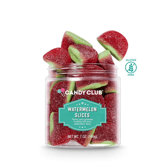 A clear plastic jar filled with red and green watermelon-flavored jelly candies, with the Candy Club branding and 'Watermelon Slices' label visible. Available at Be Charmed