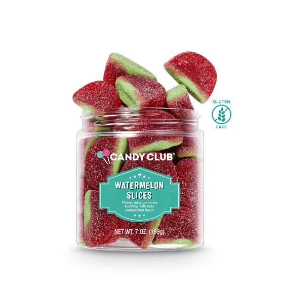 A clear plastic jar filled with red and green watermelon-flavored jelly candies, with the Candy Club branding and 'Watermelon Slices' label visible. Available at Be Charmed