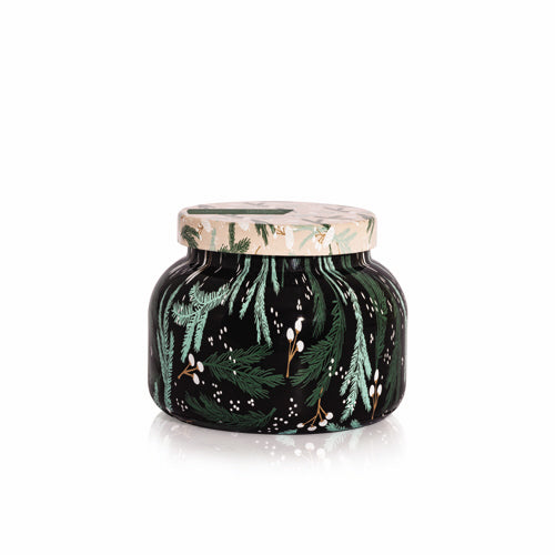 Capri Blue Crystal Pine candle in a decorative pattern jar with green leaf pattern on a white background. Available at Be Charmed. 