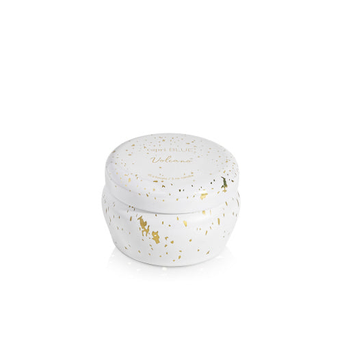 Capri Blue volcano glimmer mini tin candle in a white container with gold speckles on a white background. Available at Be Charmed. 