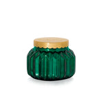 Capri Blue volcano green glass jar candle with a gold lid on a white background. Available at Be Charmed. 