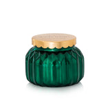Capri Blue royal gem green glass candle jar with a gold lid on a white background. Available at Be Charmed. 