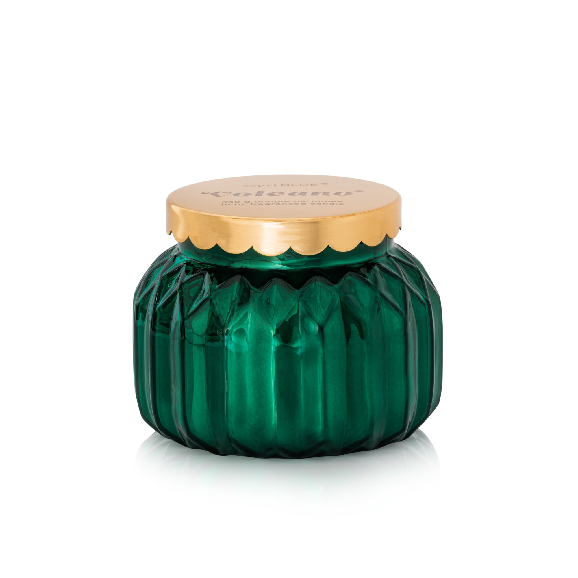 Capri Blue royal gem green glass candle jar with a gold lid on a white background. Available at Be Charmed. 