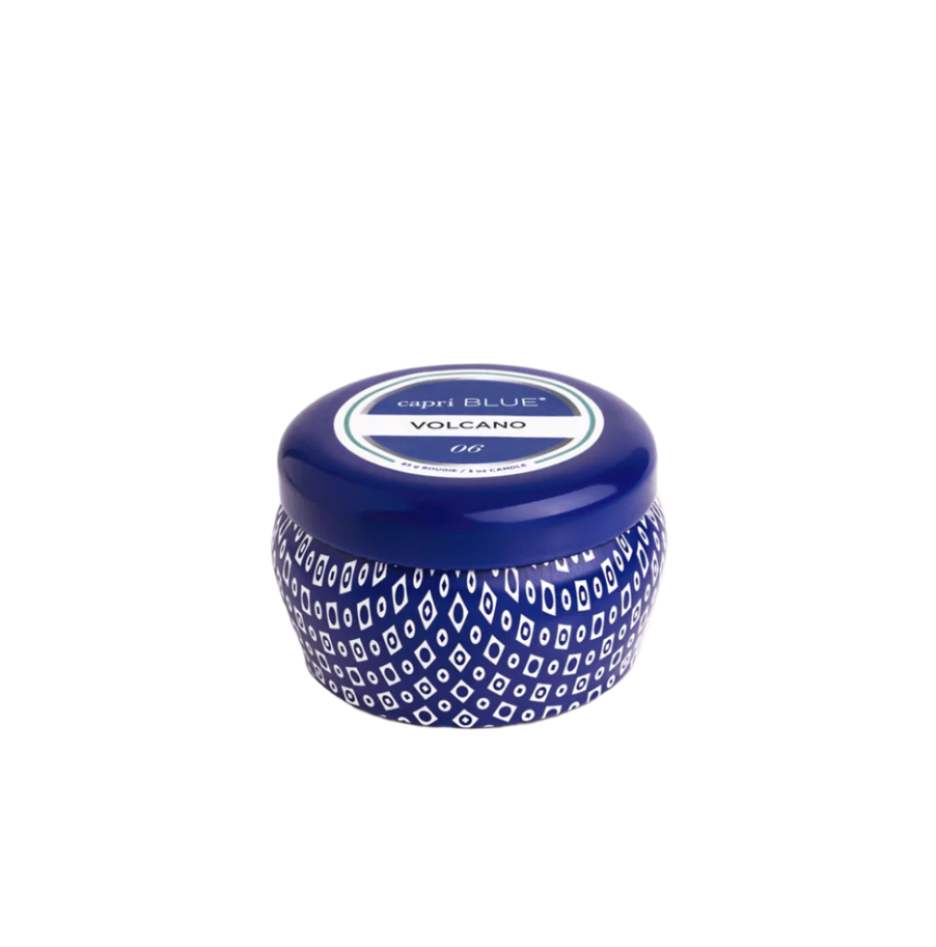 Capri Blue Volcano Blue Mini Tin Candle—3 oz cobalt-blue tin with tropical citrus and sugared pineapple scent, portable and stylish, available at Be Charmed.