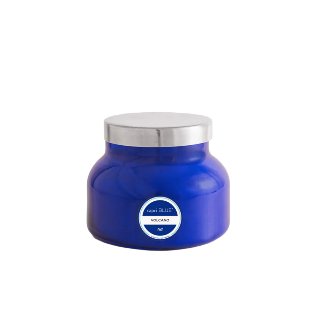Volcano Signature Jar Candle by Capri Blue—clear glass jar with iconic orange wax, fresh citrus and pineapple fragrance, clean cotton wick, available at Be Charmed.