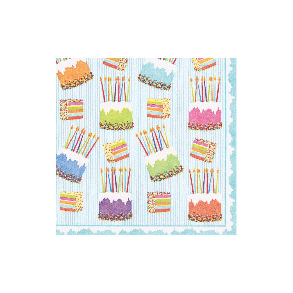 Pattern of colorful birthday cakes with candles on a blue striped napkin. Available at Be Charmed