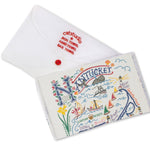 Folded with packaging Catstudio Nantucket dish towel featuring hand-illustrated island icons and coastal details, decorative and functional kitchen linen celebrating island pride, Available at Be Charmed