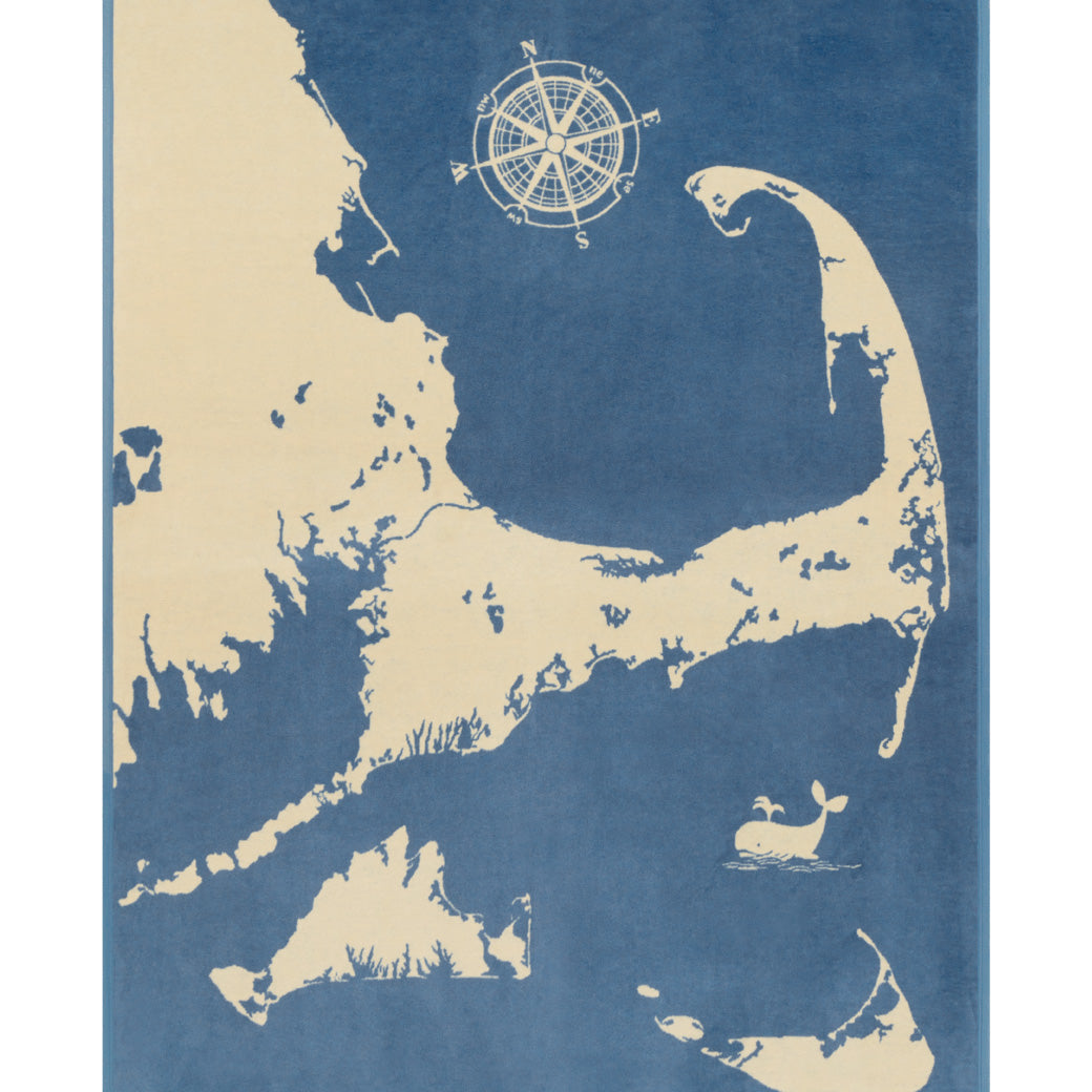ChappyWrap Cape and Islands Map Blanket with a detailed illustration of Cape Cod, Martha’s Vineyard, and Nantucket in calming ocean hues. Crafted in a soft, durable cotton blend—ideal for beach homes or New England lovers. Available at Be Charmed.