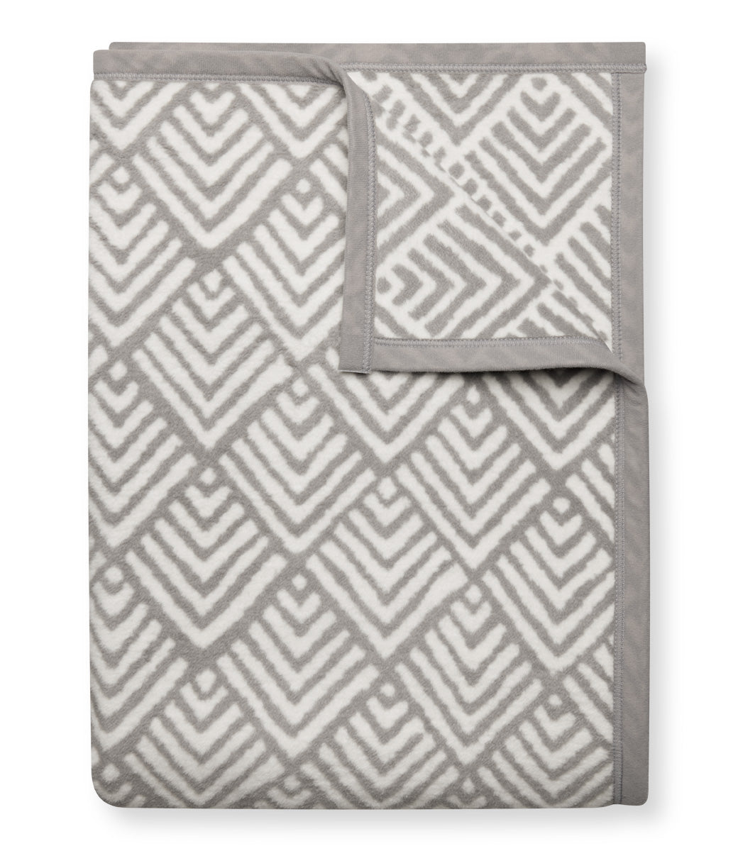 Oyster Cove Grey ChappyWrap Blanket featuring a classic diamond weave pattern, made from a cotton-blend fabric for exceptional softness and durability—ideal for cozy nights or elegant home décor. Available at Be Charmed.