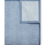 Cornflower Chappy Wrap Harborview Herringbone Blanket – Original size throw in a classic light grey herringbone pattern. Plush, durable, and machine washable. A cozy neutral accent for the home or perfect gift. Available at Be Charmed.