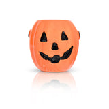 Orange pumpkin-shaped container with a black face on a white background. Available at Be Charmed