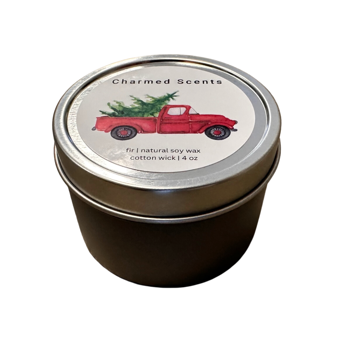 4 oz Tree Truck soy candle tin by Charmed Scents – festive holiday candle in a metal tin with evergreen aroma, rustic truck design, and clean soy wax burn, available at Be Charmed.