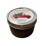 4 oz Tree Truck soy candle tin by Charmed Scents – festive holiday candle in a metal tin with evergreen aroma, rustic truck design, and clean soy wax burn, available at Be Charmed.