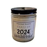 8 oz Class of 2024 soy candle by Charmed Scents – graduation-themed candle in a glass jar with clean-burning soy wax, celebratory label, and light fragrance, perfect graduation gift, available at Be Charmed.