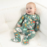 Baby wearing Angel Dear Christmas Treats 2-Way Zipper Footie with soft fabric and festive holiday treat print, available at Be Charmed.