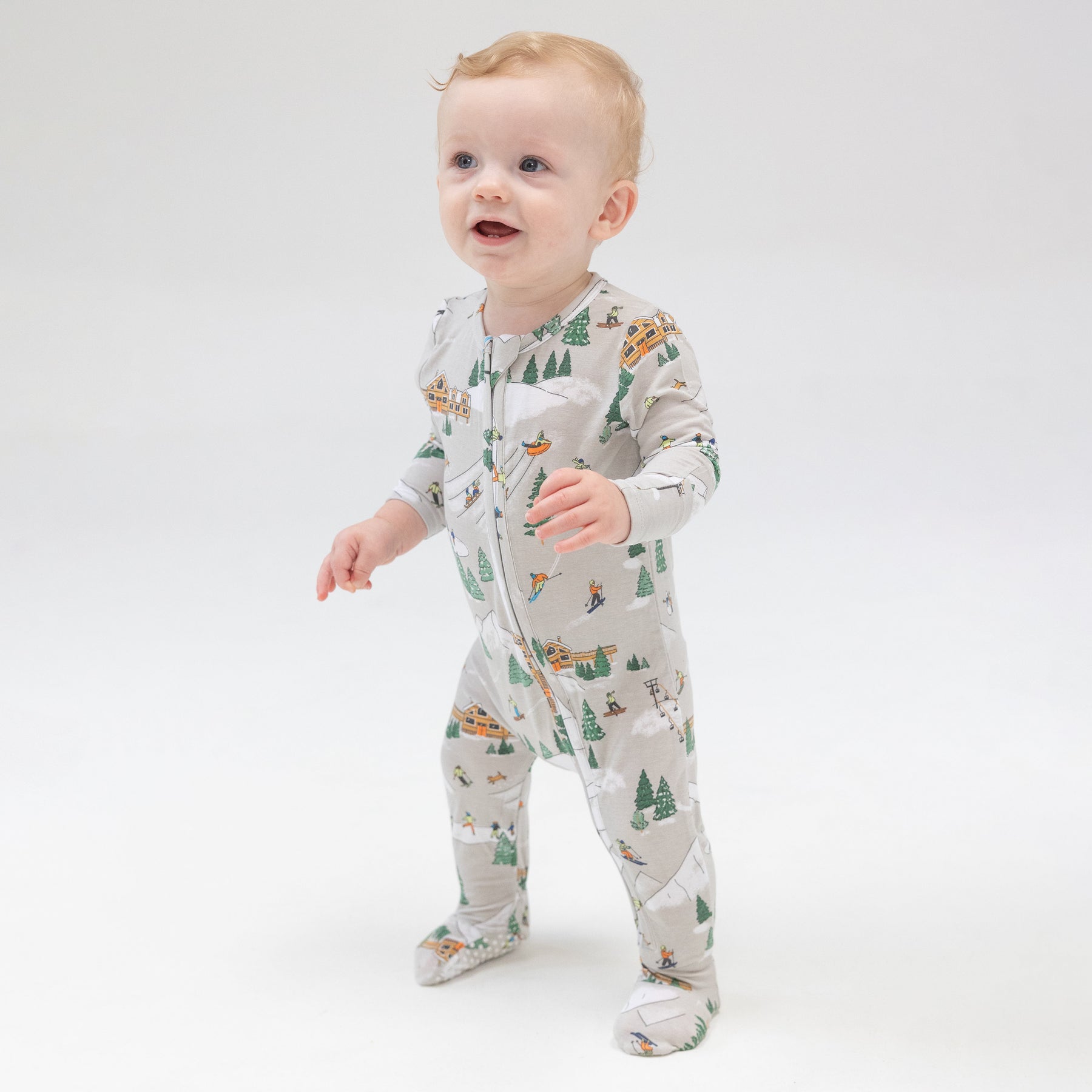 Baby wearing Angel Dear Winter Fun Skiers 2-Way Zipper Footie at Be Charmed
