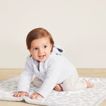 Baby wearing Blue CozyChic Infant Hoodie by Barefoot Dreams, ultra-soft baby pullover with hood, available at Be Charmed