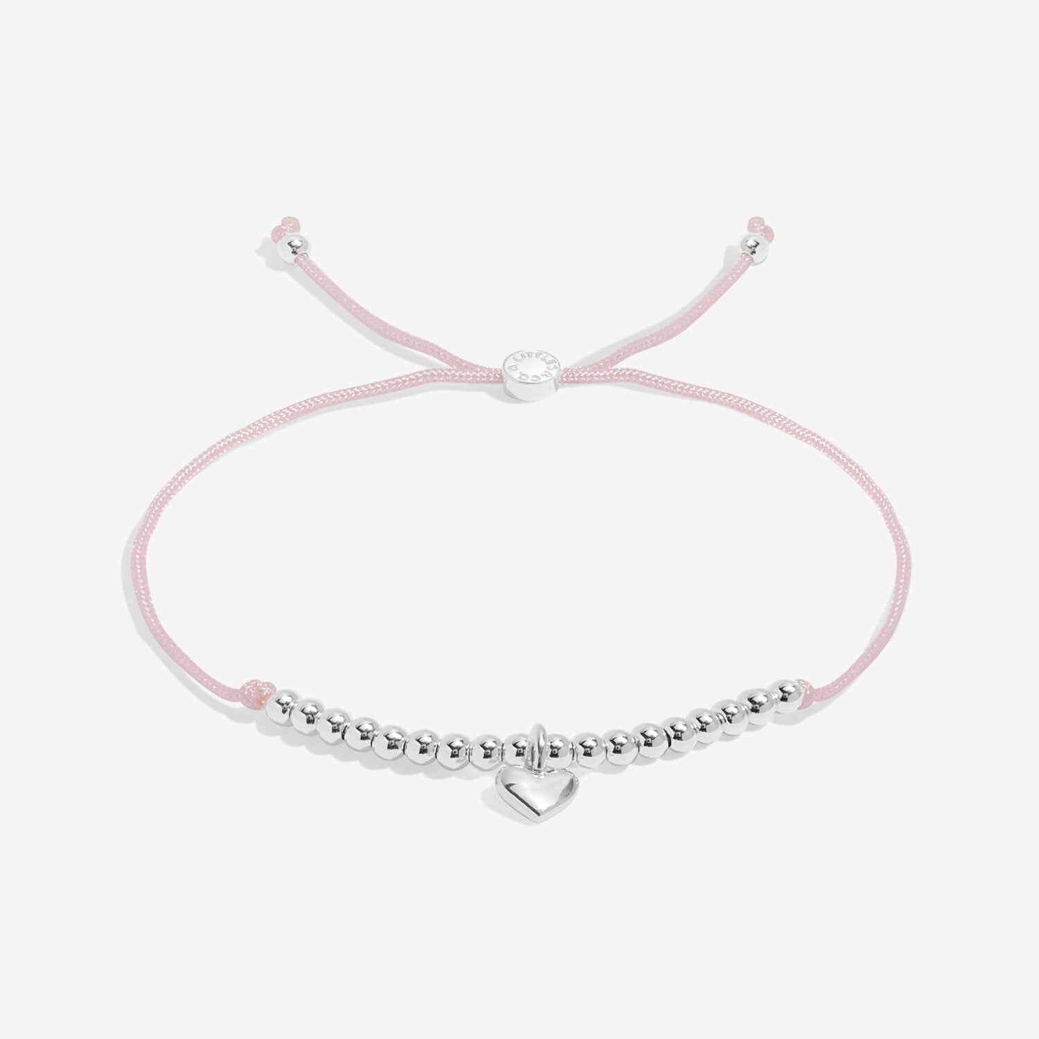Pink bracelet with silver beads and heart charm on a white background. Available at Be Charmed