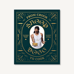 Hardcover cookbook From Crook to Cook by Snoop Dogg, ornate black and gold cover—Available at Be Charmed