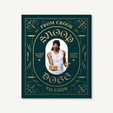 Hardcover cookbook From Crook to Cook by Snoop Dogg, ornate black and gold cover—Available at Be Charmed